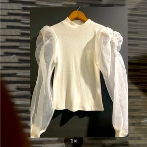 White blouse with elegant sleeves , size small in good condition .